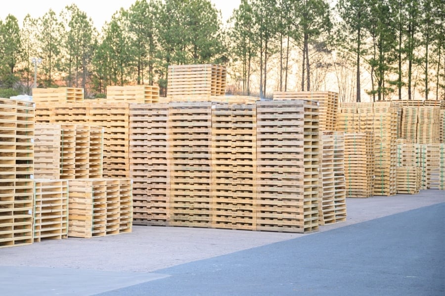 wooden pallets stacked at manufacturing facility